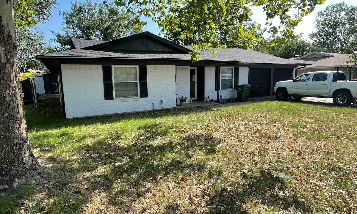 Professional roofing crew working on a residential roof in Port Sheldon